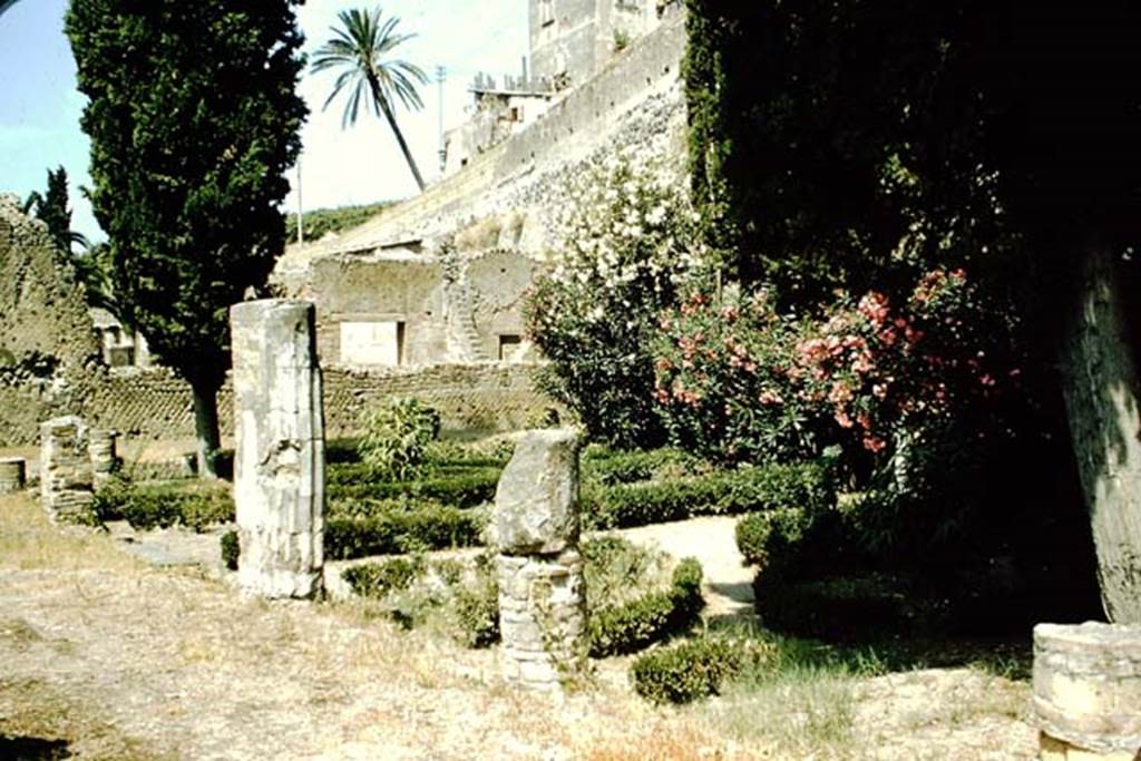 II.3 Herculaneum, 1957. Looking south-west across peristyle from the east portico.
Photo by Stanley A. Jashemski.
Source: The Wilhelmina and Stanley A. Jashemski archive in the University of Maryland Library, Special Collections (See collection page) and made available under the Creative Commons Attribution-Non Commercial License v.4. See Licence and use details. J57f0434